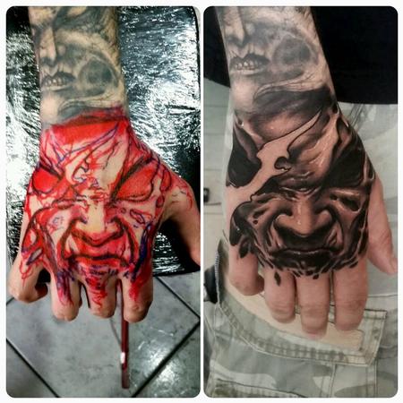 Tattoos - evil face on hand - 128777